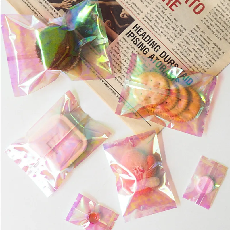 100Pcs 레인보우 투명 레이저 플랫 포켓 캔디 비스킷 베이킹 기계 봉인 된 가방 파티 선물 포장