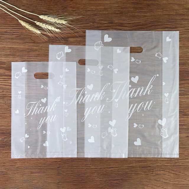 Upgrade your gift packaging game with 50pcs Plastic Bags Thank You Cookie&Candy&Bread Bag Packaging Bags