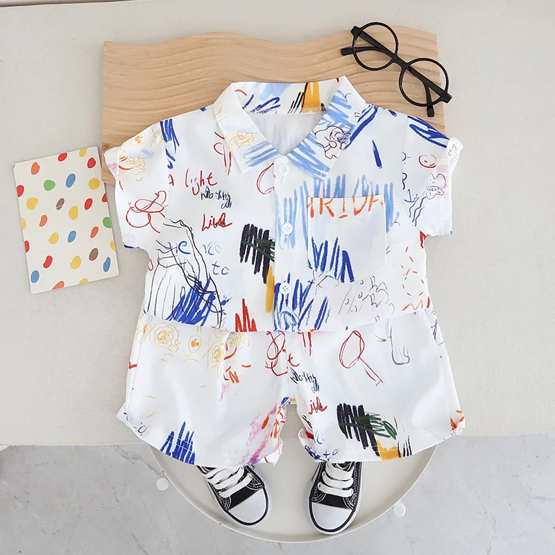 

Kids Summer Sets 2024 New Korean Fashion Leisure Turn Down Collar Graffiti Shirt Short Sleeve and Shorts Boys Boutique Clothing