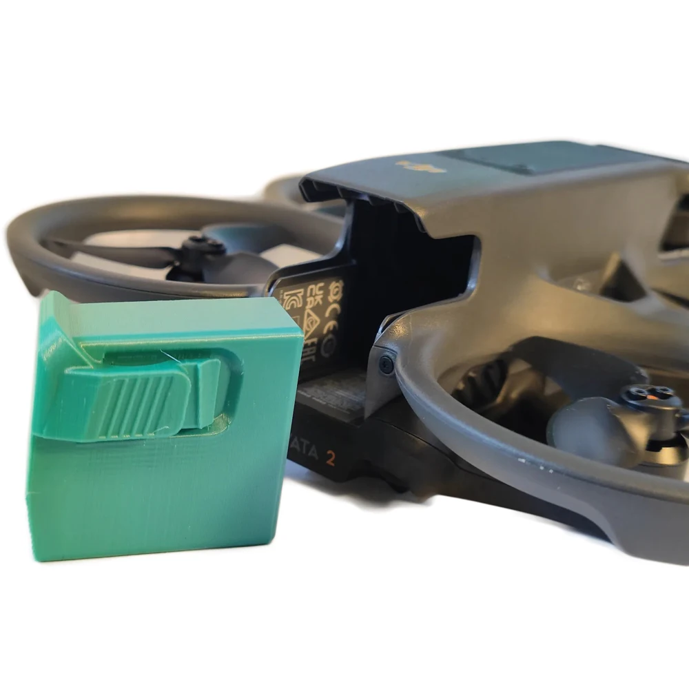Couvercle de protection anti-poussière pour batterie DJI Avata 2 en vert, avec les clips de fixation