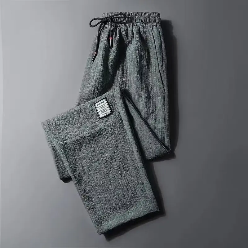 thumbnail image 1 of Pantalones de hombre de seda de hielo transpirables de verano de color sólido pantalones de lino sueltos casuales para hombre Pantalones deportivos de moda urbana, 1 of 5