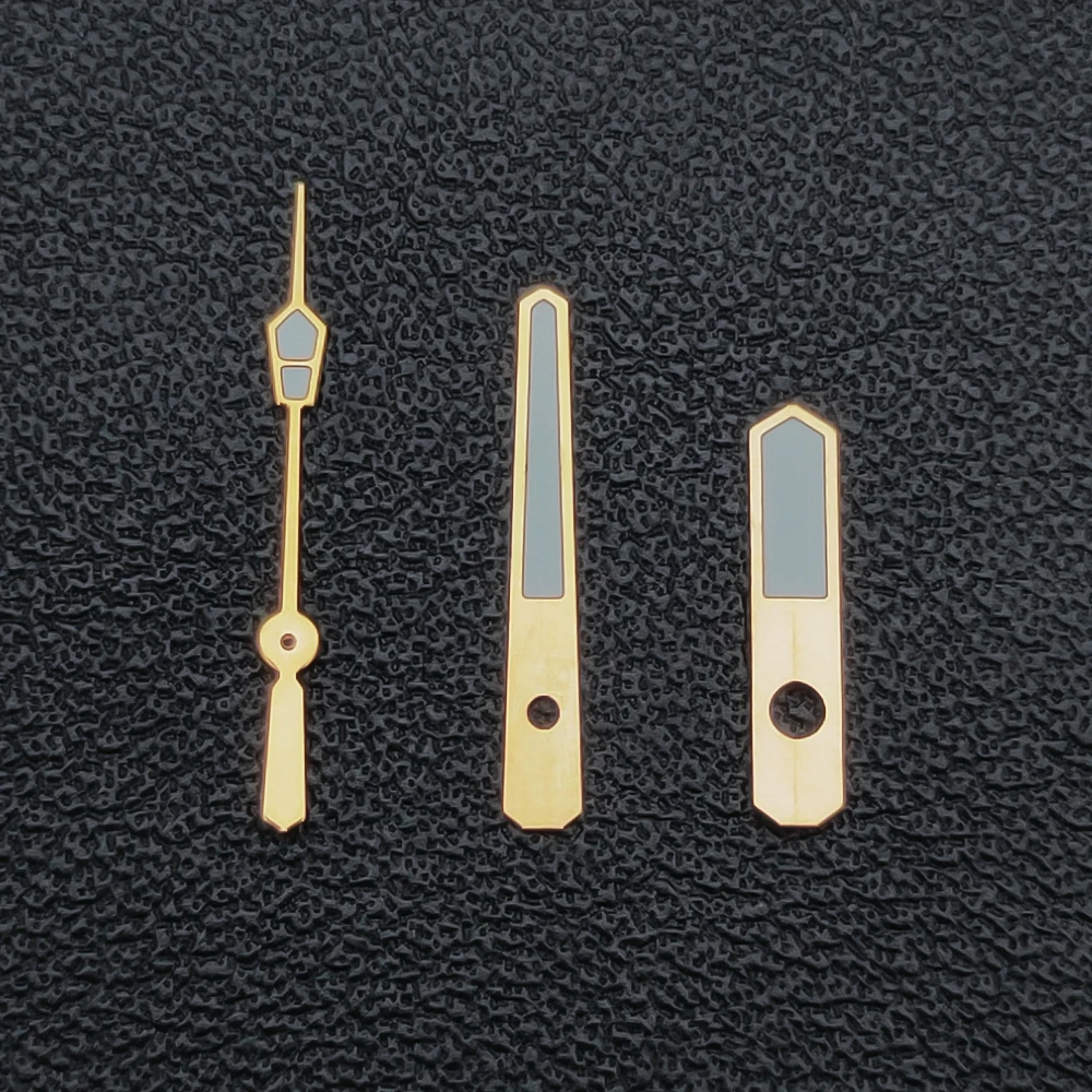 Elegant Silver, Gold, and Rose Gold Watch Hands with Green Luminescence