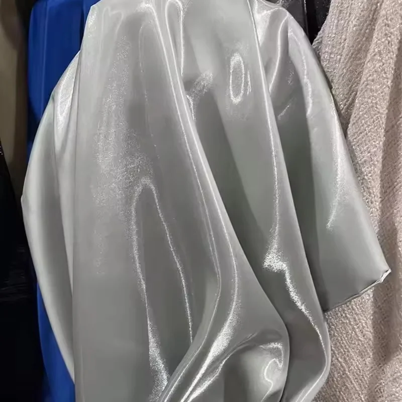 Blue Luxury Glossy Metallic Reflective Satin Fabric for Fashion and Formal Wear