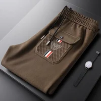 Luxury brand jacquard casual pants men's spring autumn high-end waffle elastic waistband drawstring pocket embossed sports pants 1