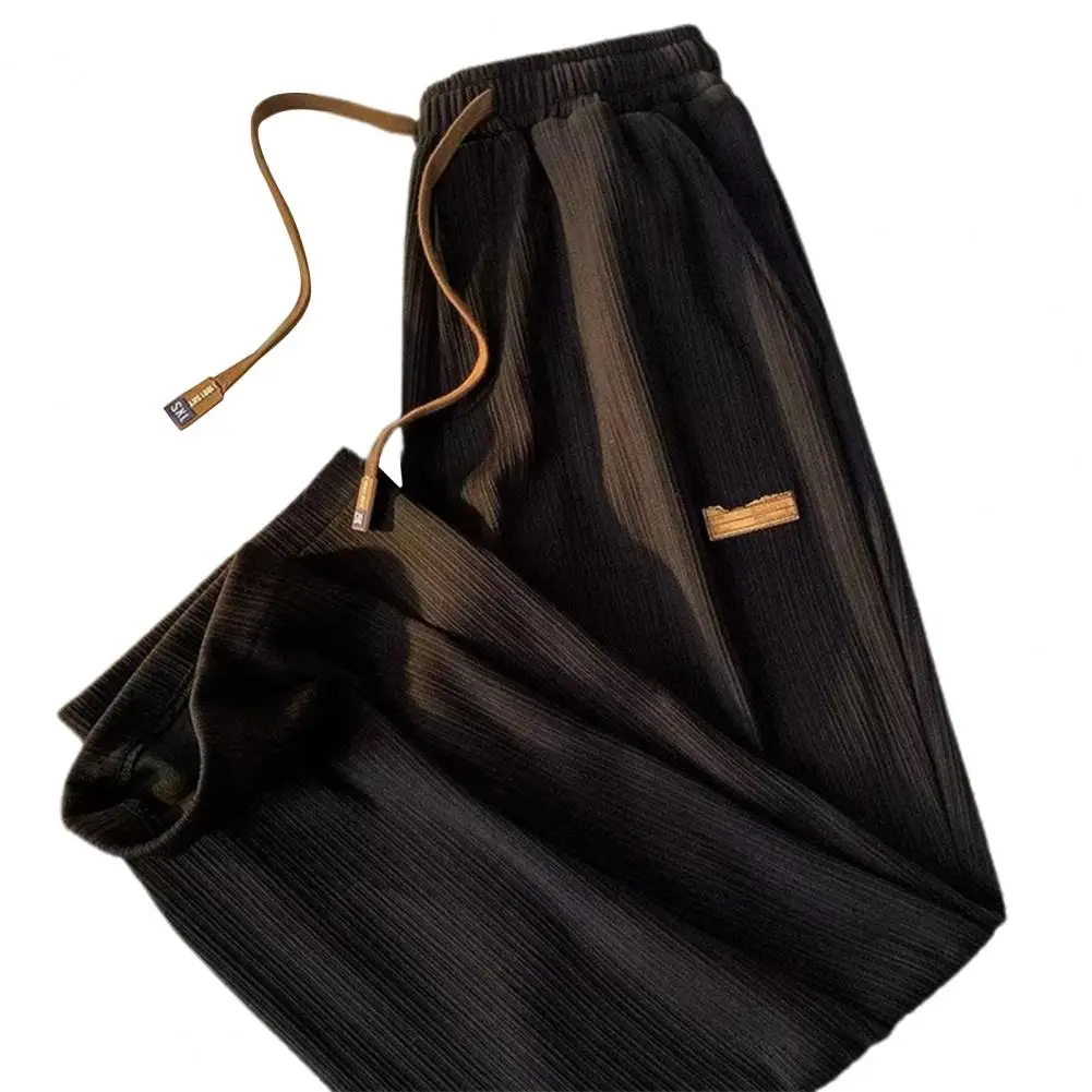 Description Picture 3 of itemMid-rise Elastic Waistband Men Pants Drawstring Pockets Ribbed Fast Drying Summer Ultra-thin Ice Silk Casual Trousers Streetwear