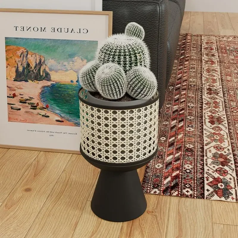 A Minimalist Iron Art Indoor Potted Plant Stand with A Mobile Design Resembling Rattan Weaving Desktop Flowerpot