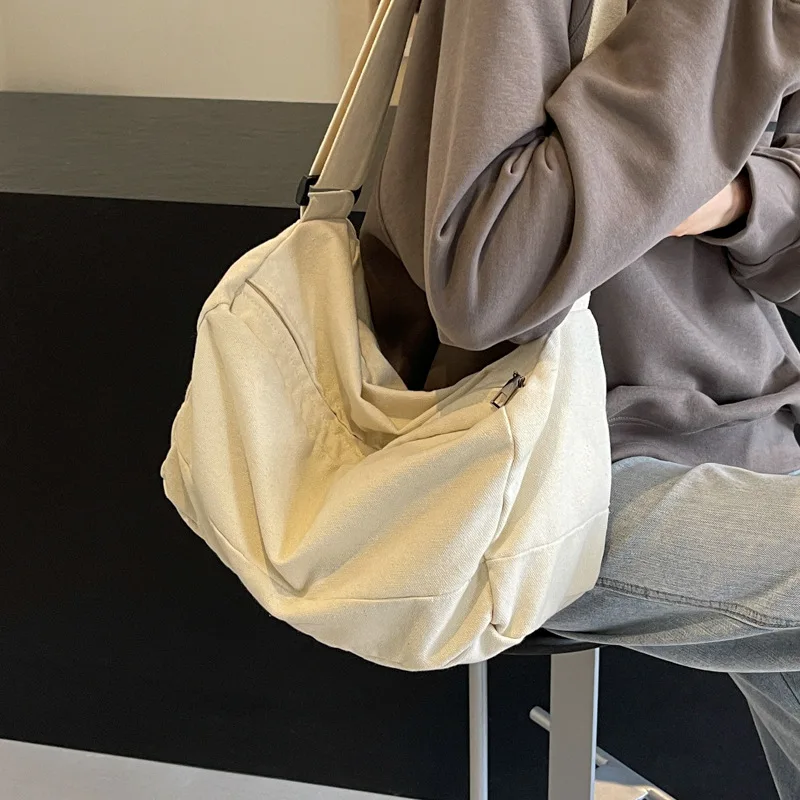 

Fashion Joker Washed Canvas Small Bag Women's 2024 new advanced texture jiaozi bag western style large capacity slung.