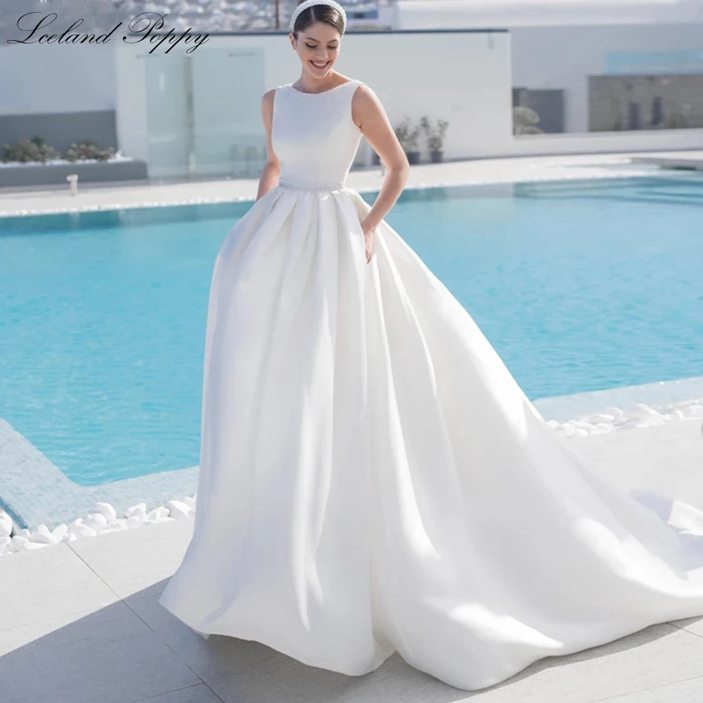 

Lceland Poppy Women's A Line Scoop Neck Satin Wedding Dresses Floor Length Beaded Backless Bridal Gowns with Court Train