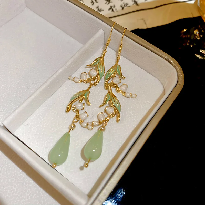 S0e70b724f9dc414cb6bb0b64086d78f1J Elegant White Orchid Flower Earring for Women Ladies Temperament Metal Leaves Long Tassel Drop Earrings Hook Jewelry Accessories Mallzona