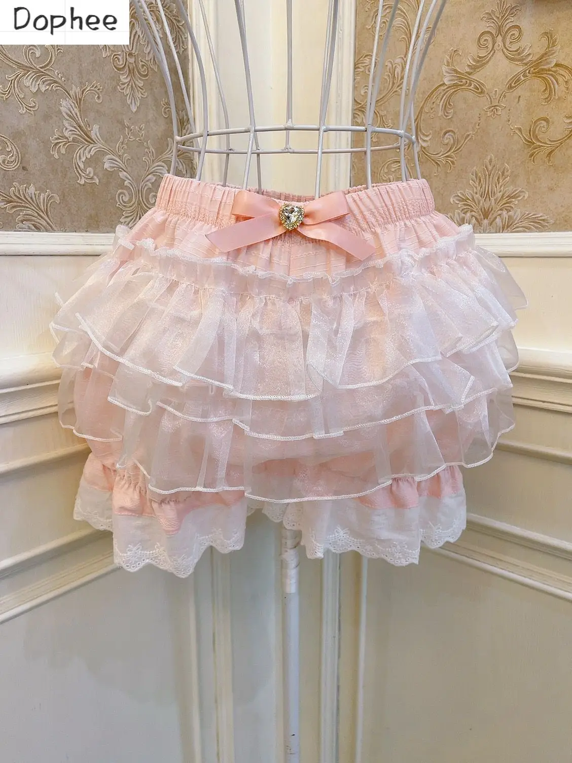 

Милые юбки Dophee с бантом для девушек, шорты с пышной юбкой, подходят ко всему, Женские базовые брюки с эластичным поясом и оборками, милые домашние шорты