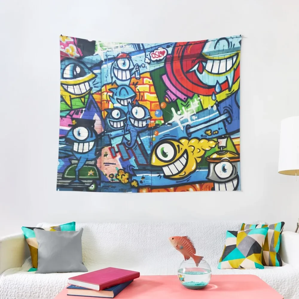 Graffiti Urban colorful graffiti city wall comical cartoon fishes with big eyes doing graffitis Tapestry