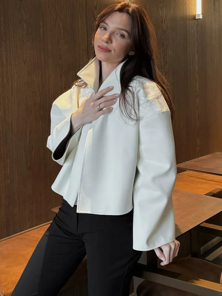 Cropped Faux Leather Jacket With Stand Collar, Flare Sleeves and Asymmetric Wrap Front — photo 1