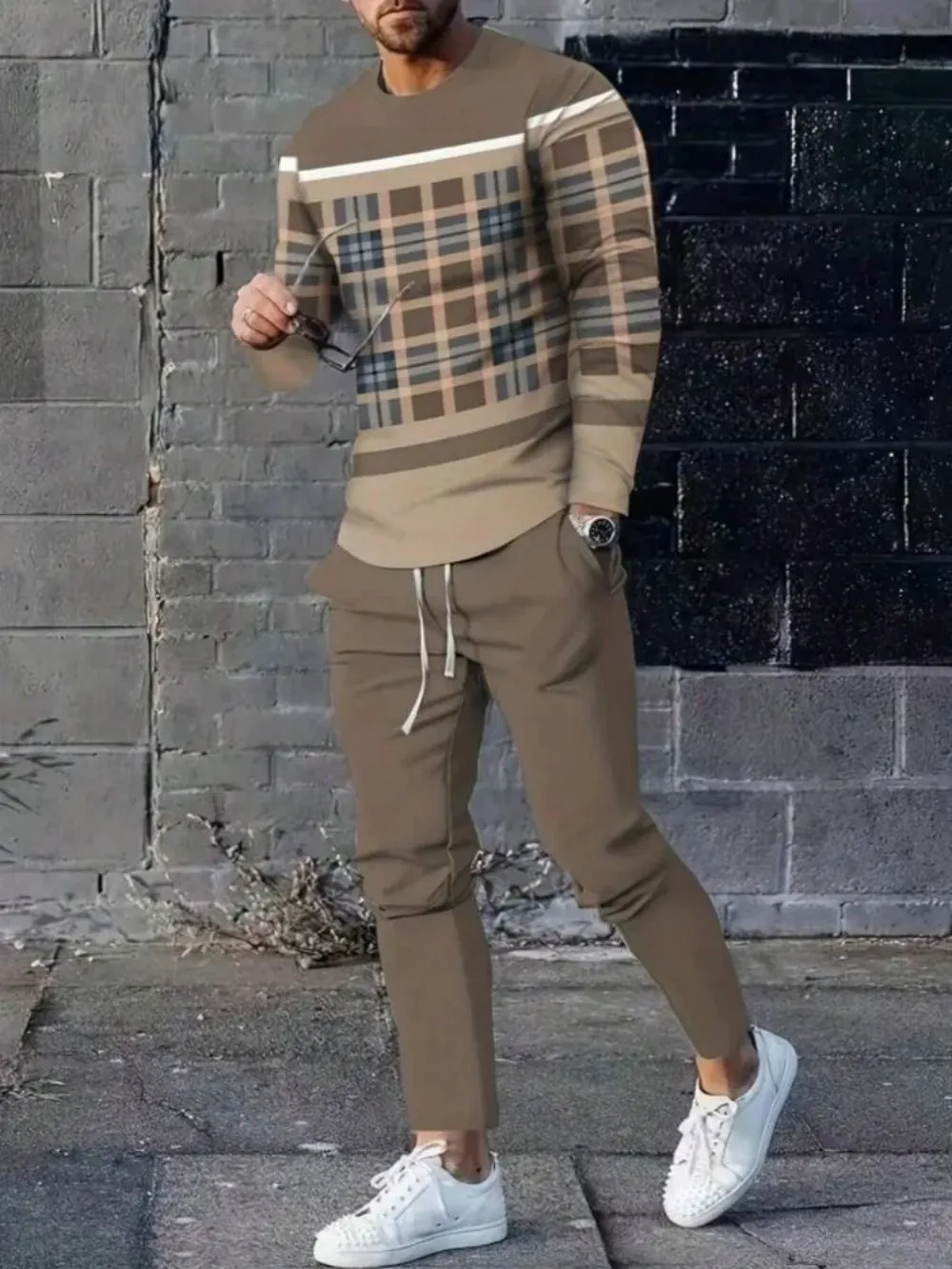 Man wearing striped patchwork long sleeve top and pants set in a sunny outdoor setting Khaki