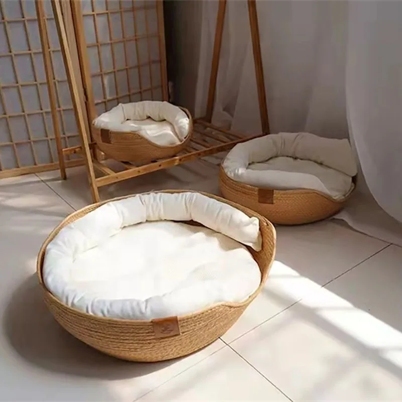 Three Handmade Bamboo Weave Pet Beds by The Stuff Box with waterproof removable white cushions are arranged on a tiled floor, in front of a shoji screen and next to a white curtain.