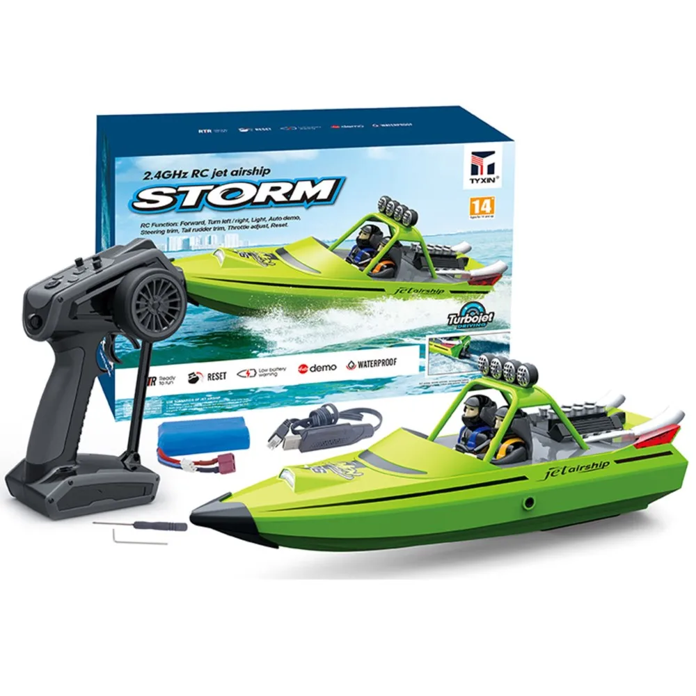 Bateau RC RTR 2.4GHz 200m vert avec lumières, de face sur l'eau calme.