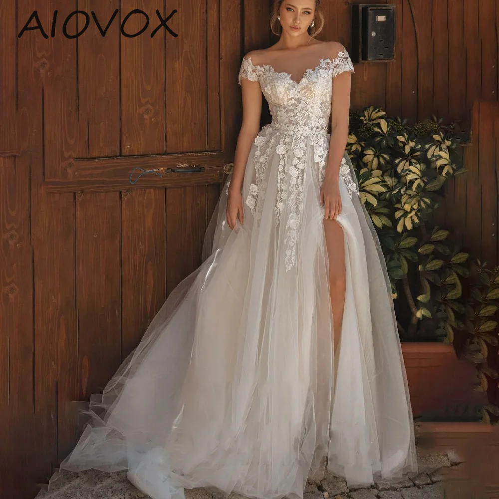 

ADORZA A-line Wedding Dress Elegant Front Slit Illusion Scoop Neck Cap Sleeves Tulle Appliques Lace Covered Button váy cưới 2024