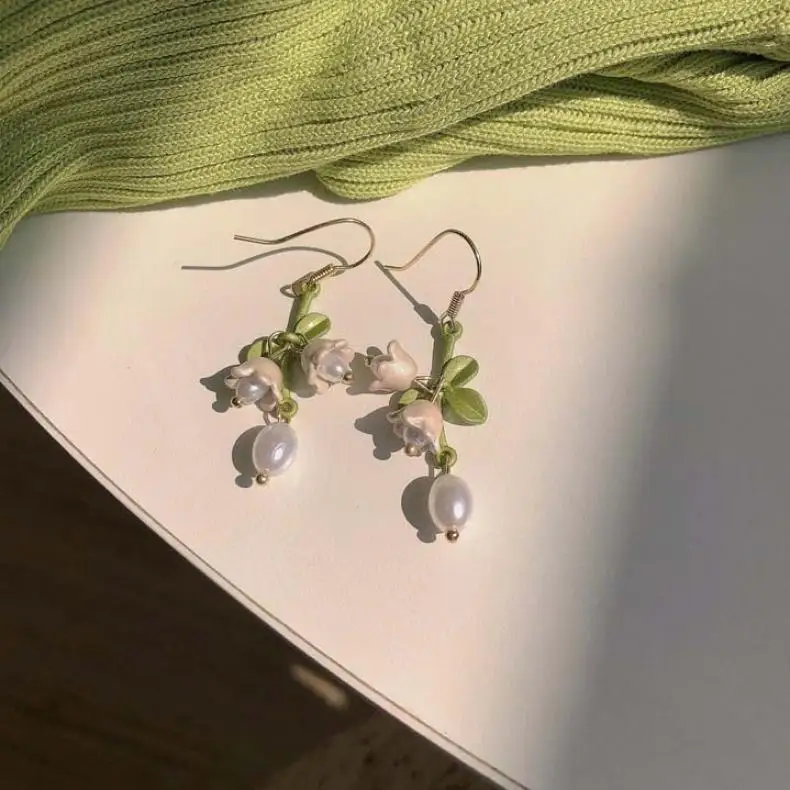 S0fe03efa31b940e0b2860a910c8c1bb9M Elegant White Orchid Flower Earring for Women Ladies Temperament Metal Leaves Long Tassel Drop Earrings Hook Jewelry Accessories Mallzona