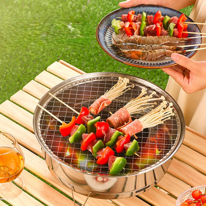 https://ae01.alicdn.com/kf/S0fe1ec822ada48d1ac1a84e79fdf3f29x/Stainless-Steel-Round-BBQ-Grill-Outdoor-Picnic-Portable-Kebab-Grill-Iron-Nets-Barbecue-Small-Charcoal-Grill.jpg