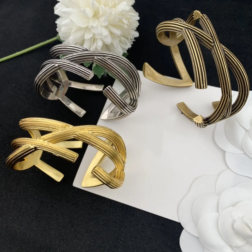 

Fashion trend abstract multi-sided line ribbon twist personality design open bracelet