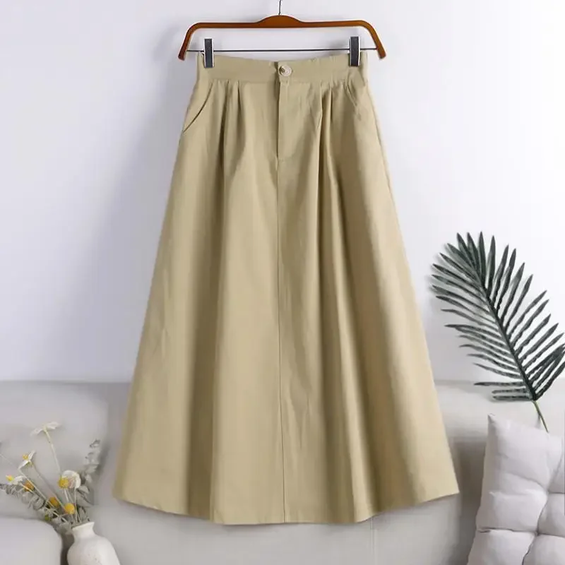 Falda de línea A de longitud media sencilla con bolsillos abotonados artísticos de gran tamaño de color sólido de otoño 2024 a la moda para mujeres