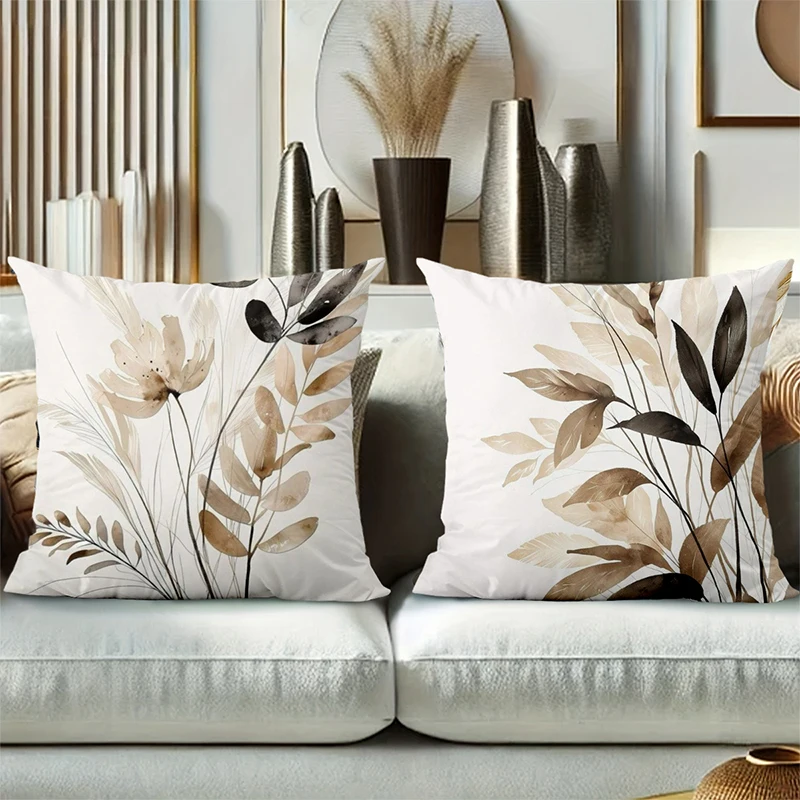 Floral leaf pillow covers decorating a modern sofa