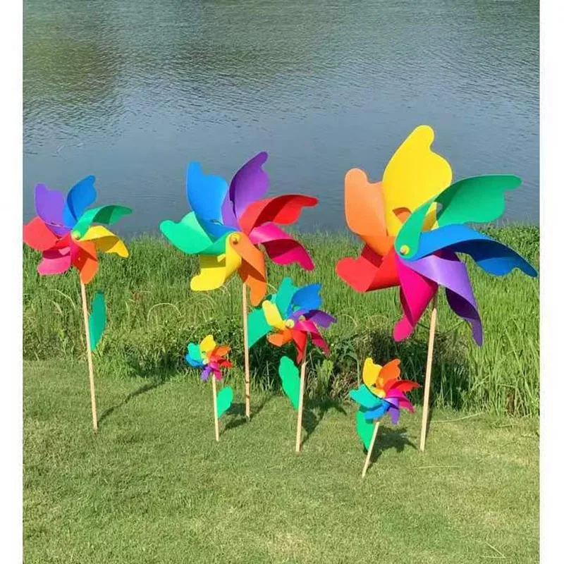 Colorful windmill outdoor decoration festival scenic park children holding rotating wooden color windmill windmill toys garden windmill
