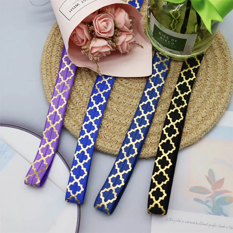 

Manufacturer Supply 15mm Gold Foil Big Quatrefoil Printed FOE Fold Over Elastic 50Yards