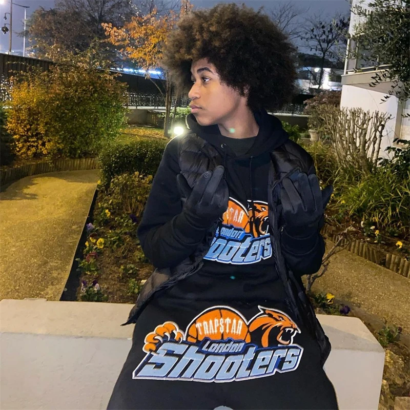 trapstar orange and black tracksuit