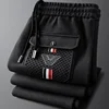 Luxury brand jacquard casual pants men's spring autumn high-end waffle elastic waistband drawstring pocket embossed sports pants 3
