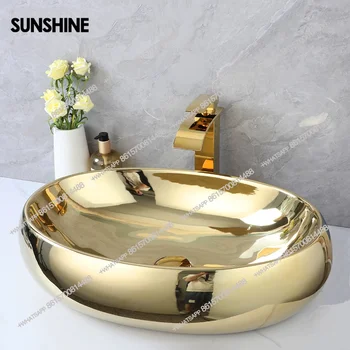 อ่างล้างหน้าแบบวางบนเคาน์เตอร์ทรงรี KEMAIDI Luxury ขนาด 23 นิ้ว สีทอง ทำจากเซรามิก พร้อมก๊อกน้ำแบบน้ำตกสีทอง 2