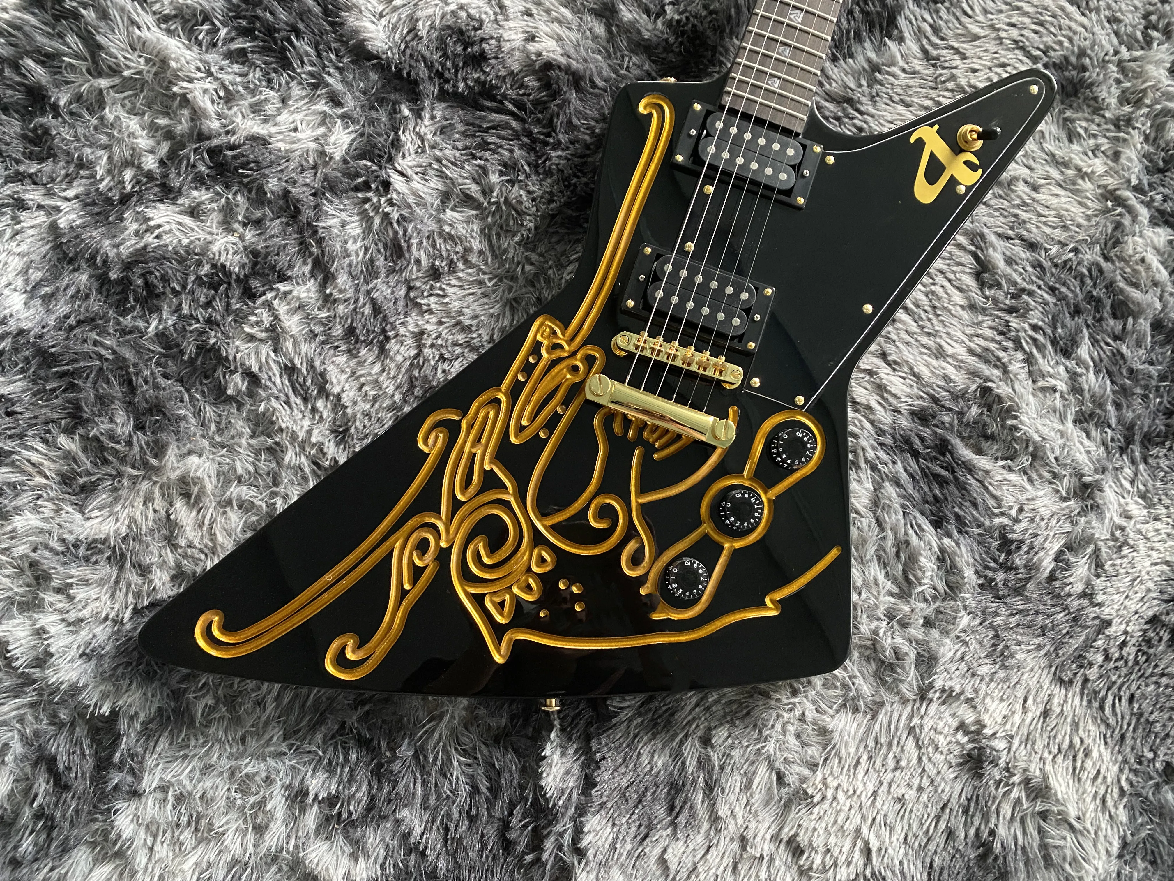 

Chinese Electric Guitar Exploer Black Color Sculpted Body Gold Hardware