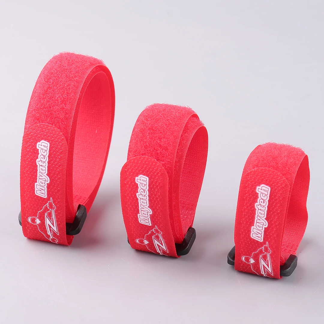 Sangles velcro auto-agrippantes pour modélisme disposées en éventail, mettant en avant les couleurs et tailles différentes.