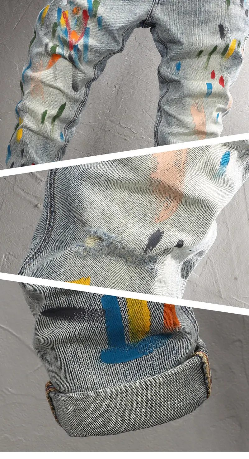 Back view showing paint-splatter, distressed rip, and hem seam detail on Drayven Edgewave Jeans