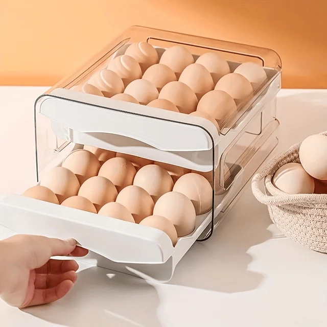 A white, 2-layer refrigerator egg drawer being pulled out from a fridge, showing neatly organized eggs.