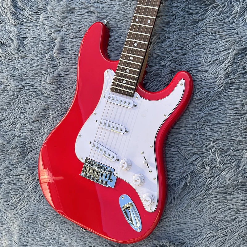 

Classic st electric guitar, quality vibrato system, original solid wood, classic big red, free delivery home.