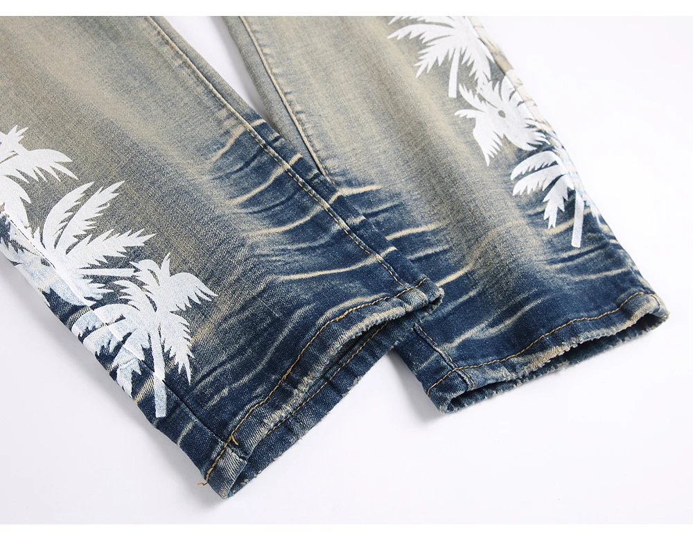 Close-up of hem stitch on SOKOTOO Men Coconut Palm Print Denim Jeans
