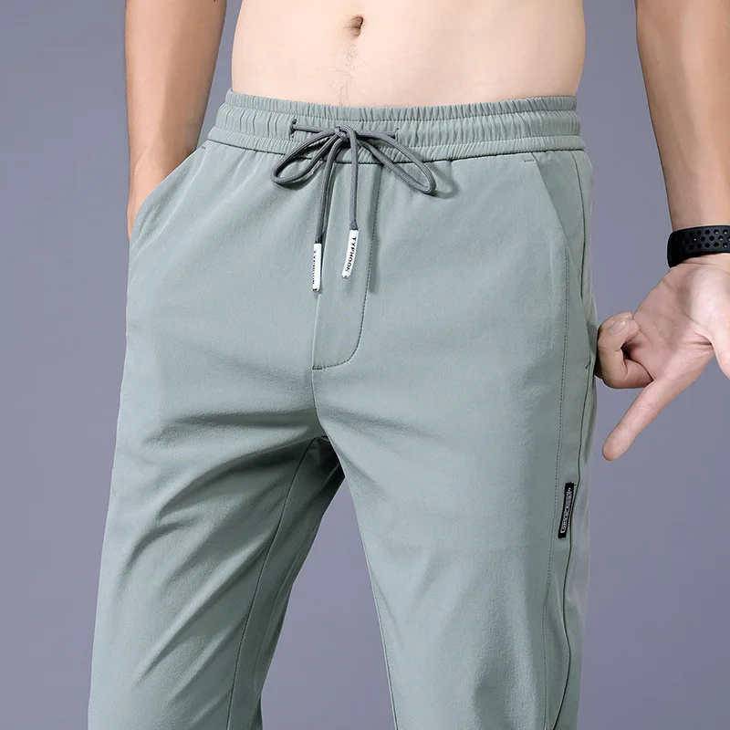 2024 Summer Ice Silk Thin Sports Pants Men's Straight Loose Elastic Non ironing Casual Pants Men's Work Wear Pants