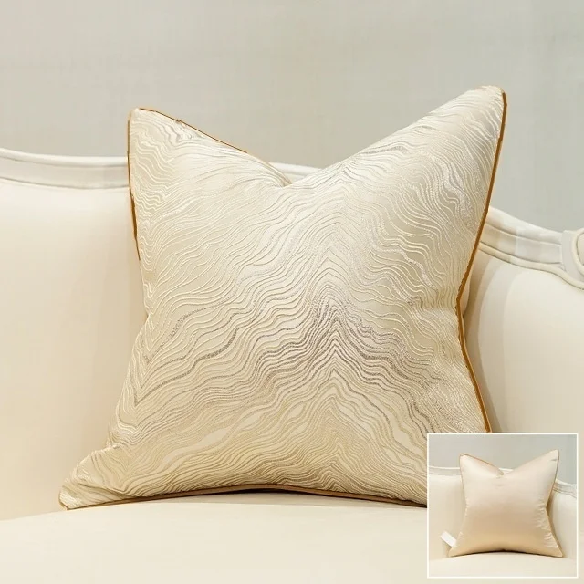 Beige jacquard cushion cover with subtle flowing-line pattern