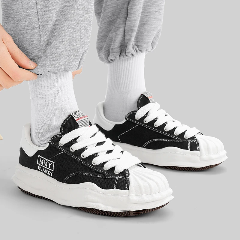 Shell head height increasing niche canvas shoes, board shoes, casual sports shoes