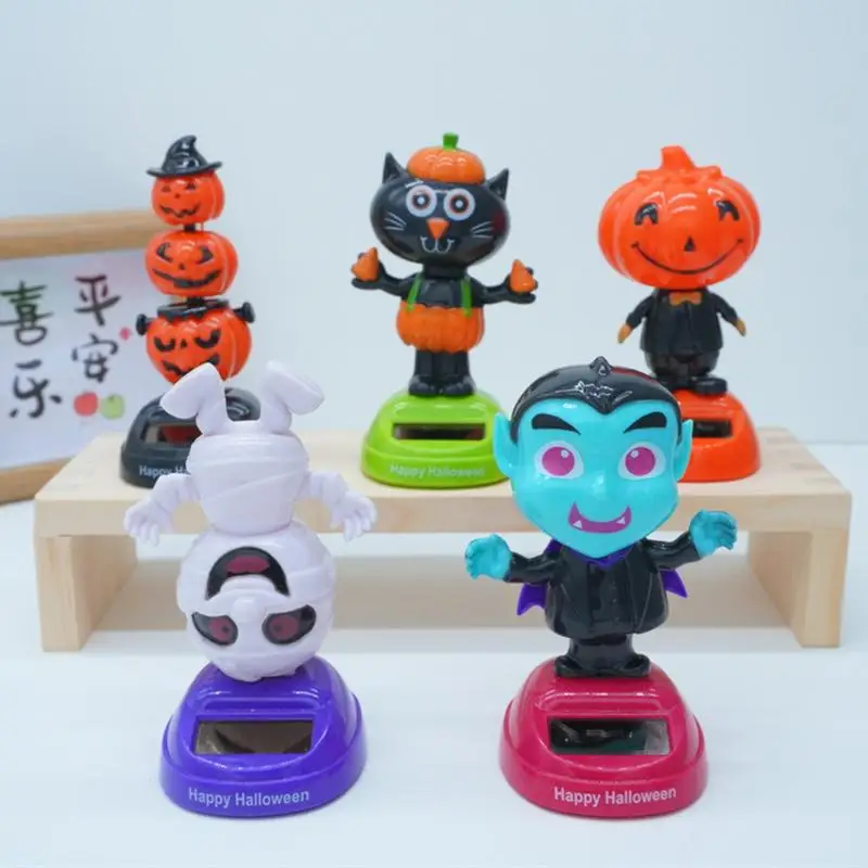 

Украшение для приборной панели автомобиля, на солнечной батарее