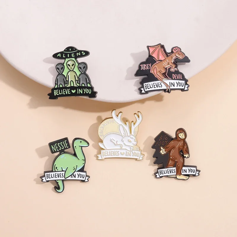 

Believe In You Aliens Enamel Pin Cryptids Nessie Devil Dinosaur Jackalope Animal Brooch Lapel Badge Alien Species Metal Jewelry