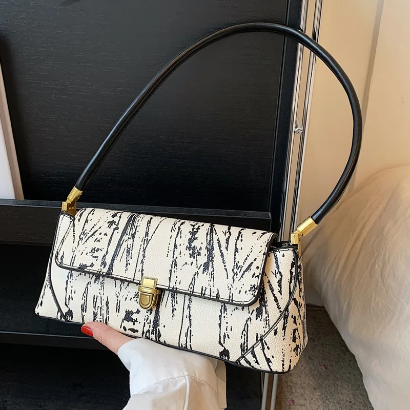 Retro high-quality underarm bag women's bag 2023 new French niche shoulder bag versatile fashion baguette bag