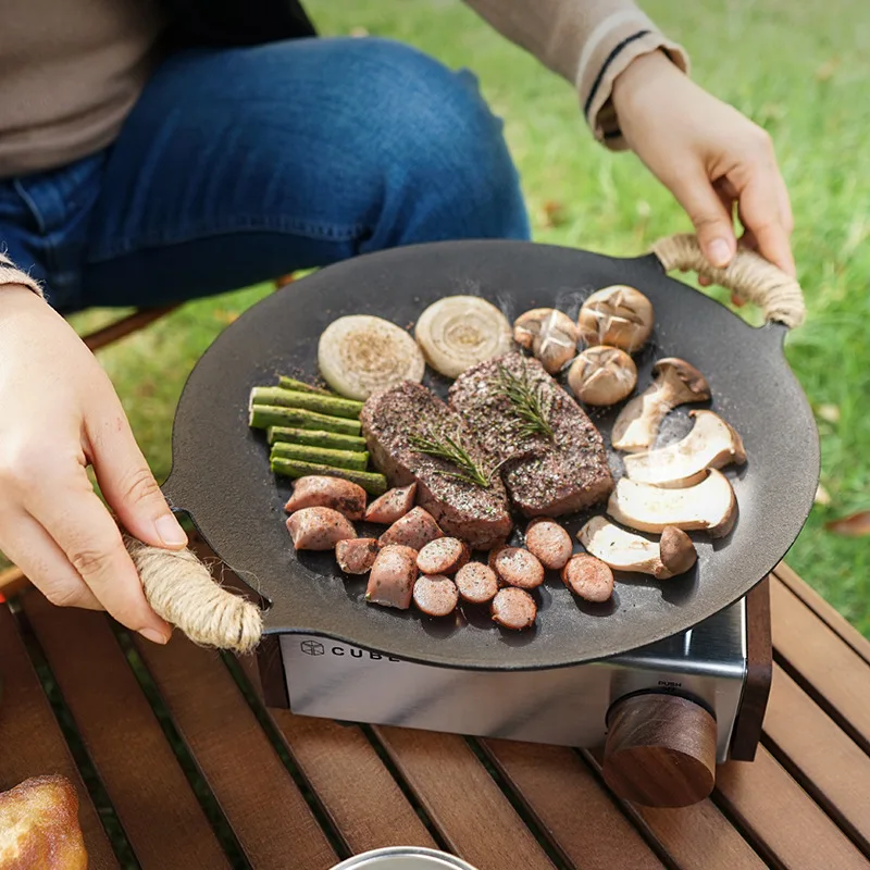 https://ae01.alicdn.com/kf/S1476e289bc18445eb7af150fe1f0d31cJ/30CM-Outdoor-Camping-Barbecue-Plate-Cast-Iron-Barbecue-Plate-Gas-Induction-Cooker-Pan-G-riddle-Plate.jpg