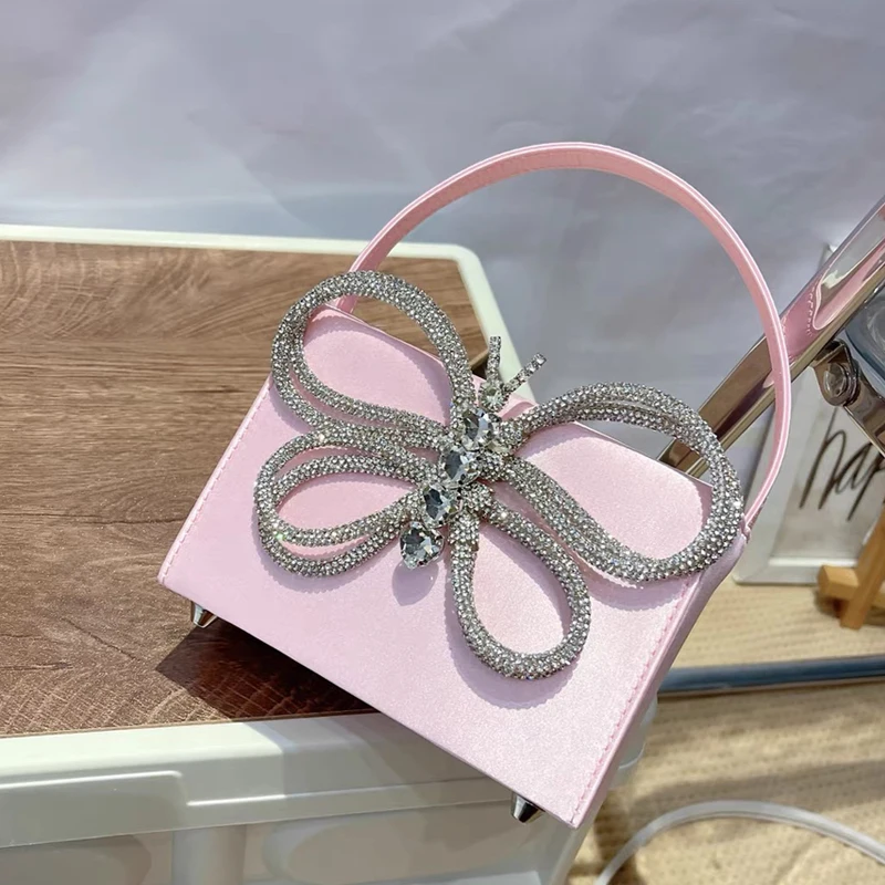 thumbnail image 1 of Mini bolsos tipo caja para mujer, bolso de mano de diseñador de lujo, novedad de 2023, en material satinado, con lazo y incrustaciones de diamantes de imitación, bolso de noche con giro, 1 of 5