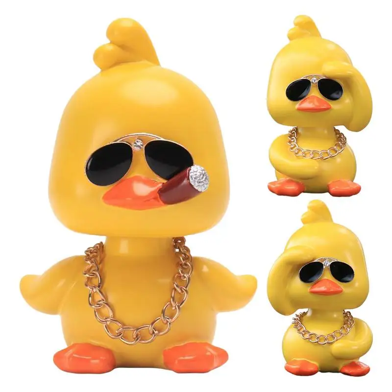 

Yellow Duck Car Ornaments Funny Shaking Head Doll With Sunglasses And Necklace Auto Internal Decoration Car Ornament Accessories