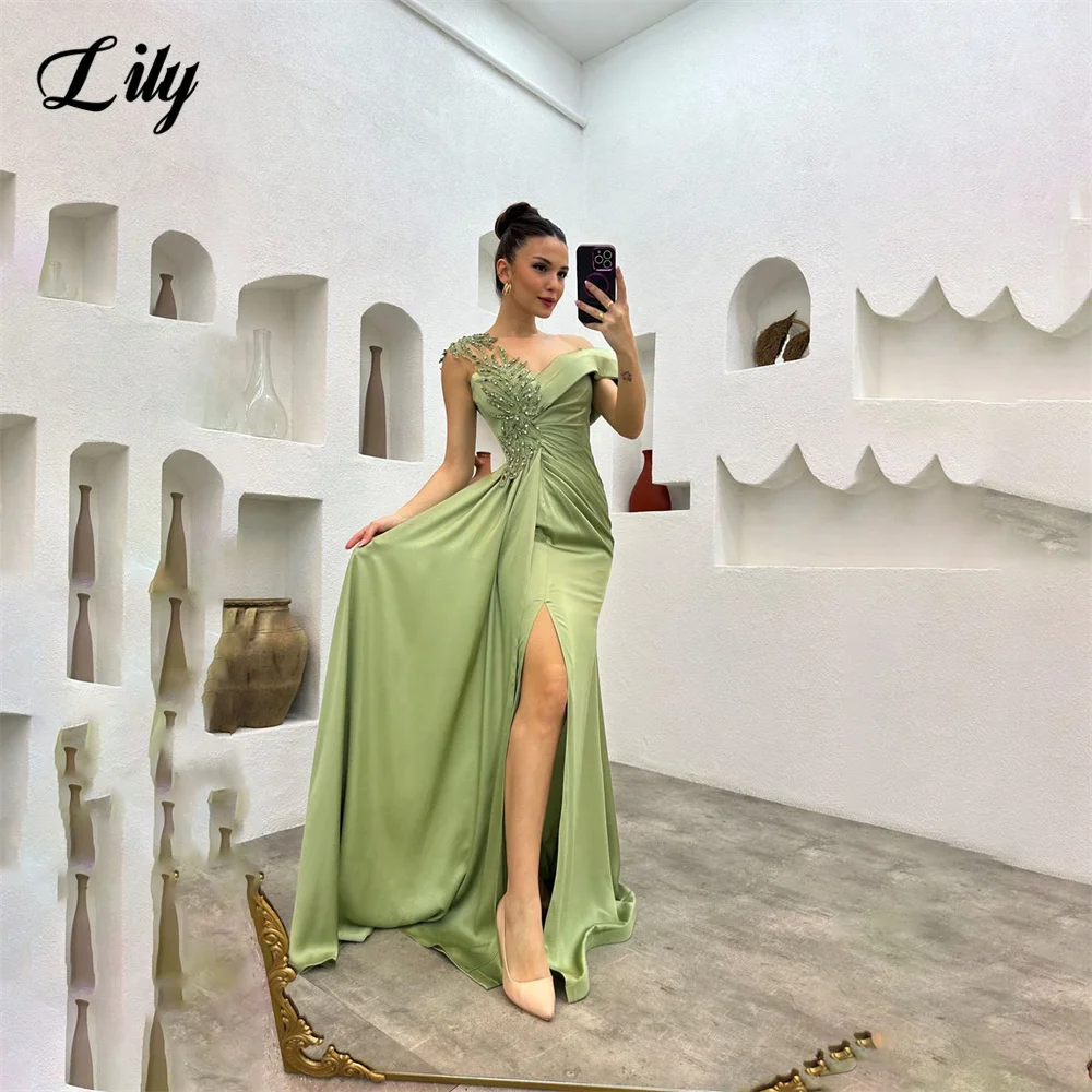 green emerald velvet dress The Lily Dress in Sage – V. Chapman main image 0