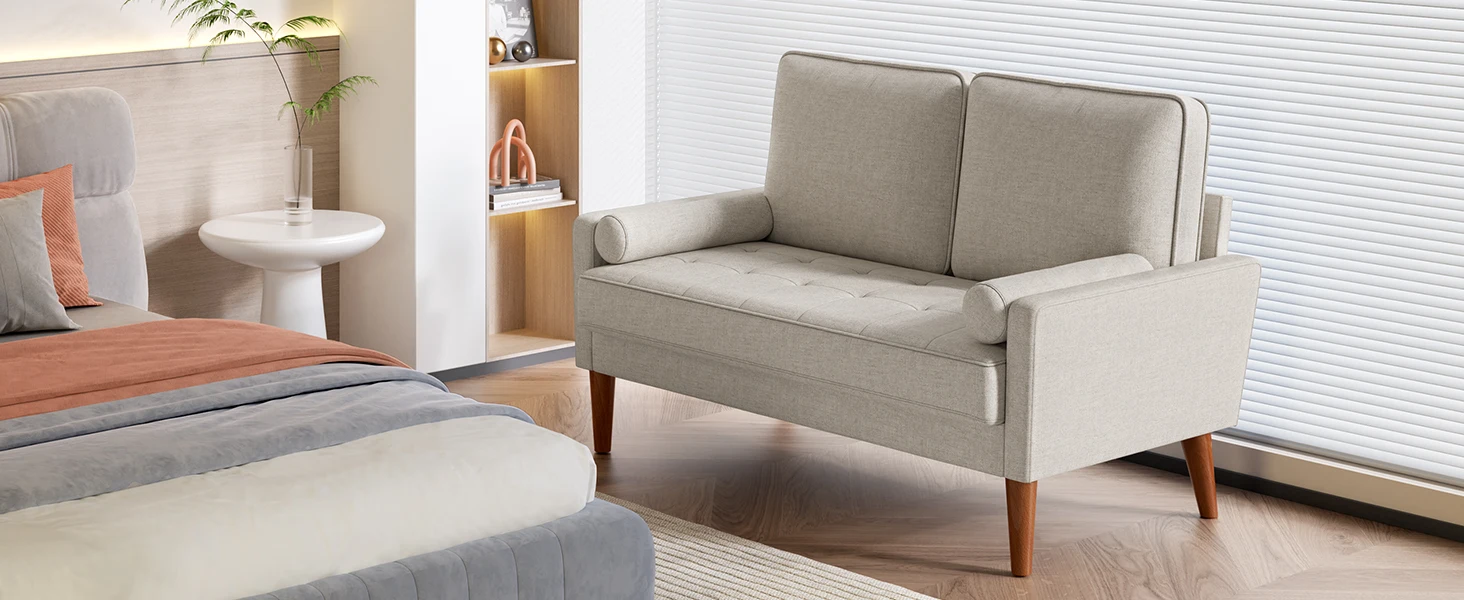 Modern light gray two-seater loveseat with clean lines, tapered wooden legs, and minimalist design shown in a bright living room setting.