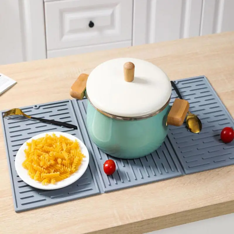 https://ae01.alicdn.com/kf/S1629303ed6a643a8a7aa77d12614beabF/Kitchen-Silicone-Dish-Drying-Mat-Heat-Resistant-Draining-Tableware-Trifold-Dinning-Mats-For-Kitchen-Collapsible-Silicone.jpg