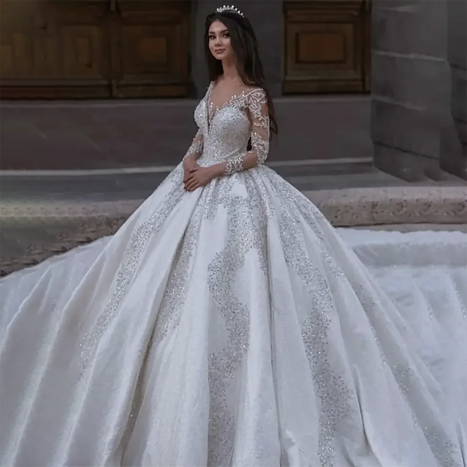 Customized New Luxurious Crystal Sequin Beaded Ball Gown Satin Wedding Dress Illusion Long Sleeves 2026 Court Train Bridal Gowns