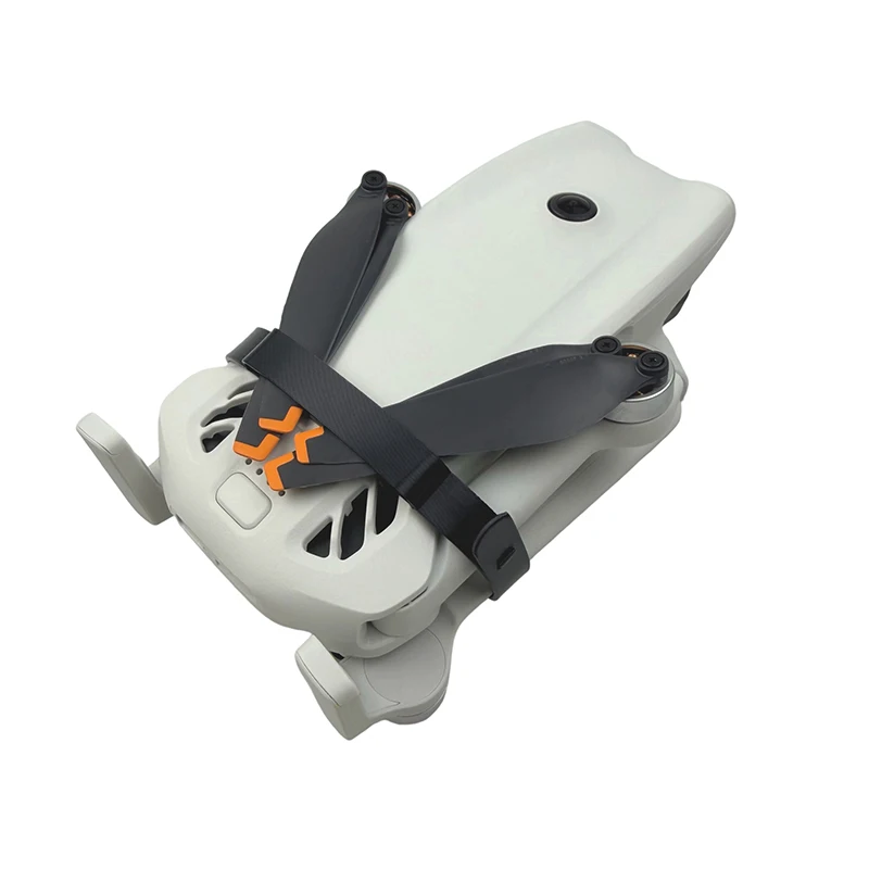 Support de protection pour lames DJI LITO en noir, posé à côté d'un drone. Achetez le support de protection pour lames DJI LITO - Sécurisez vos hélices.